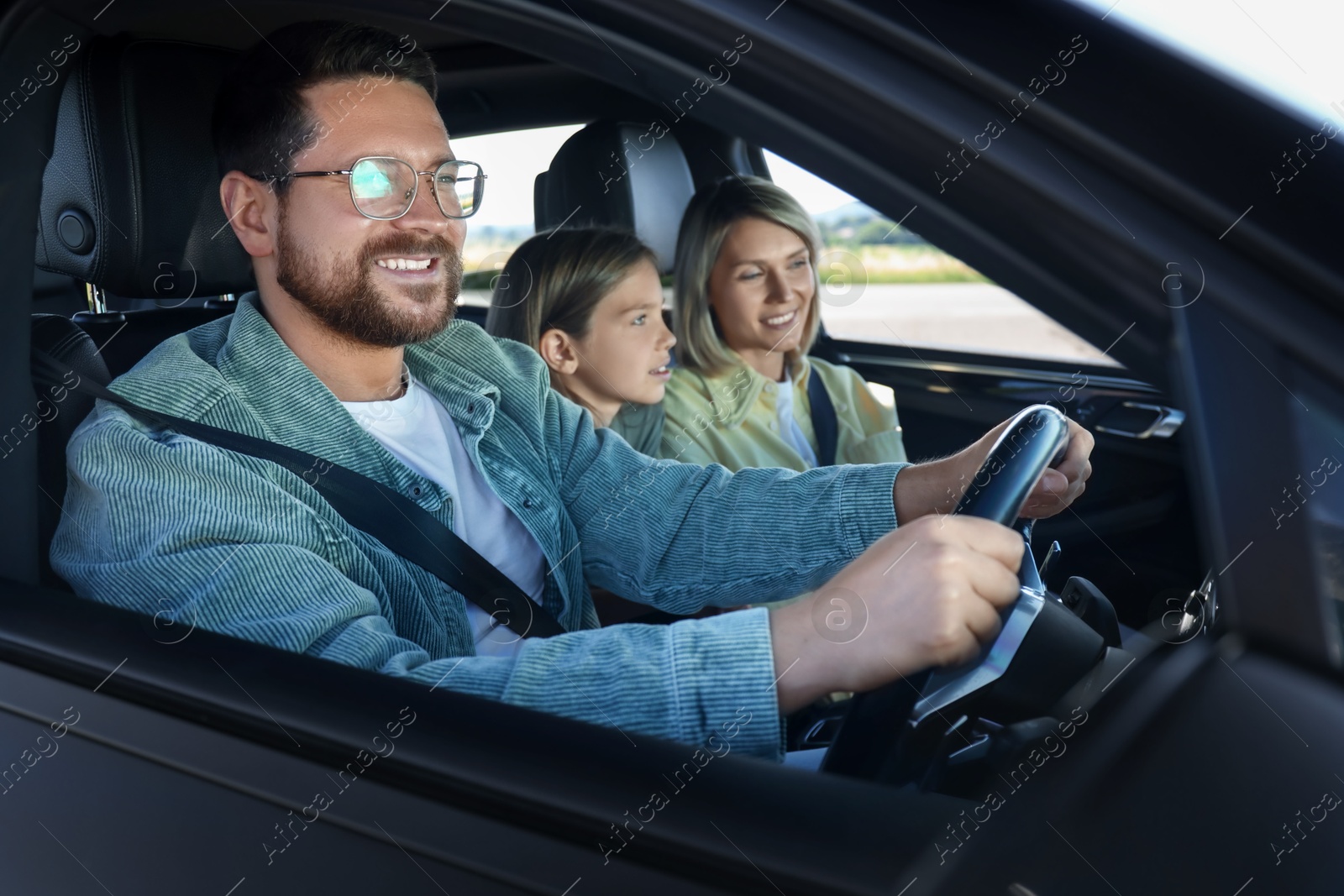 Photo of Happy family enjoying trip together by car, view from outside