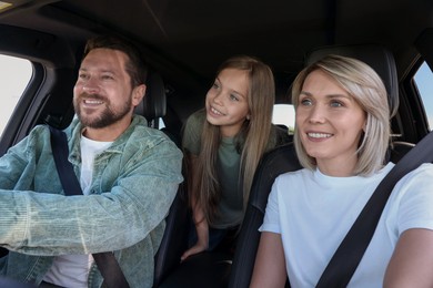 Happy family enjoying trip together by car, view from inside