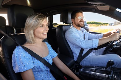 Happy family enjoying trip together by car, view from outside