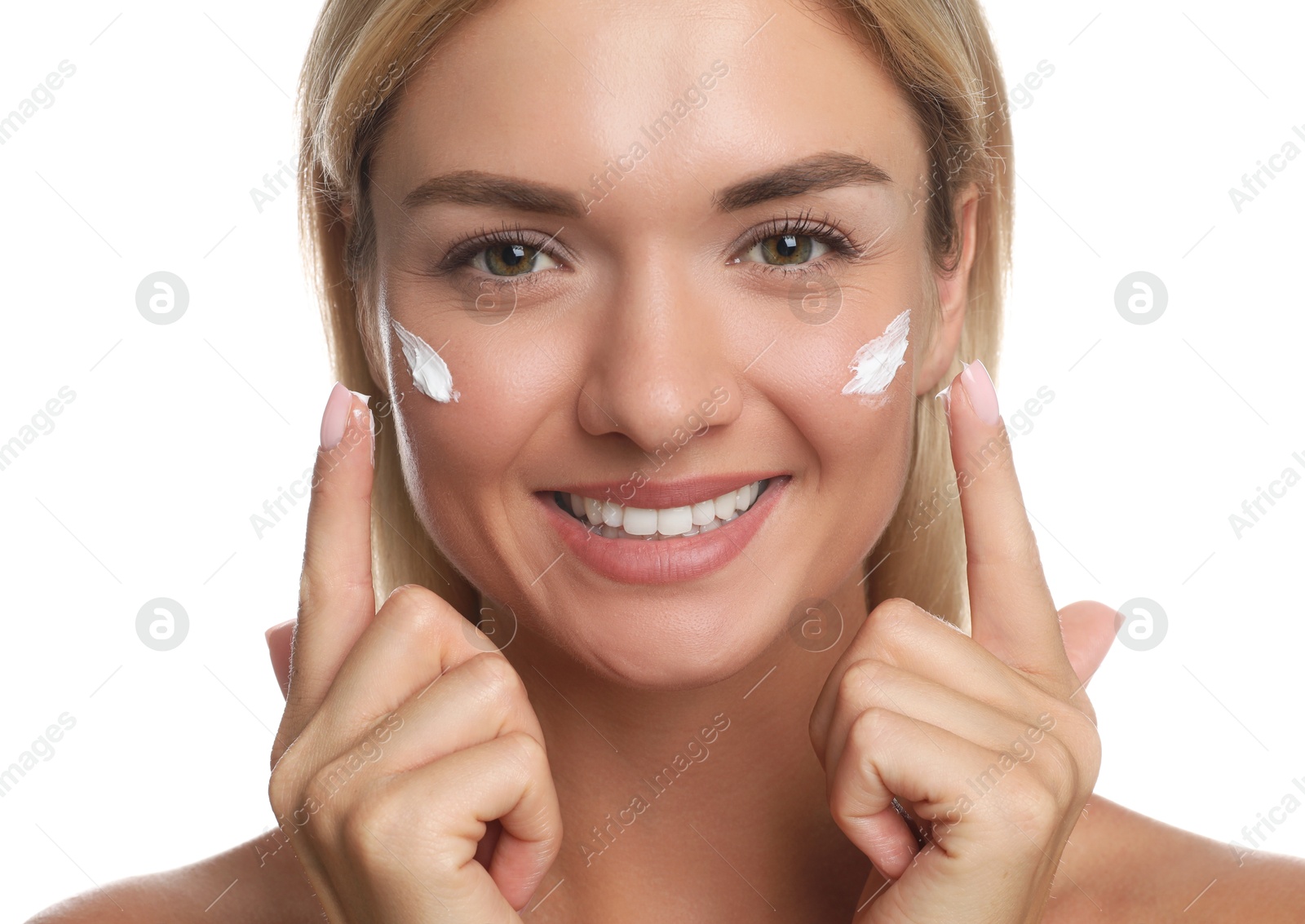 Photo of Beautiful woman applying face cream on white background