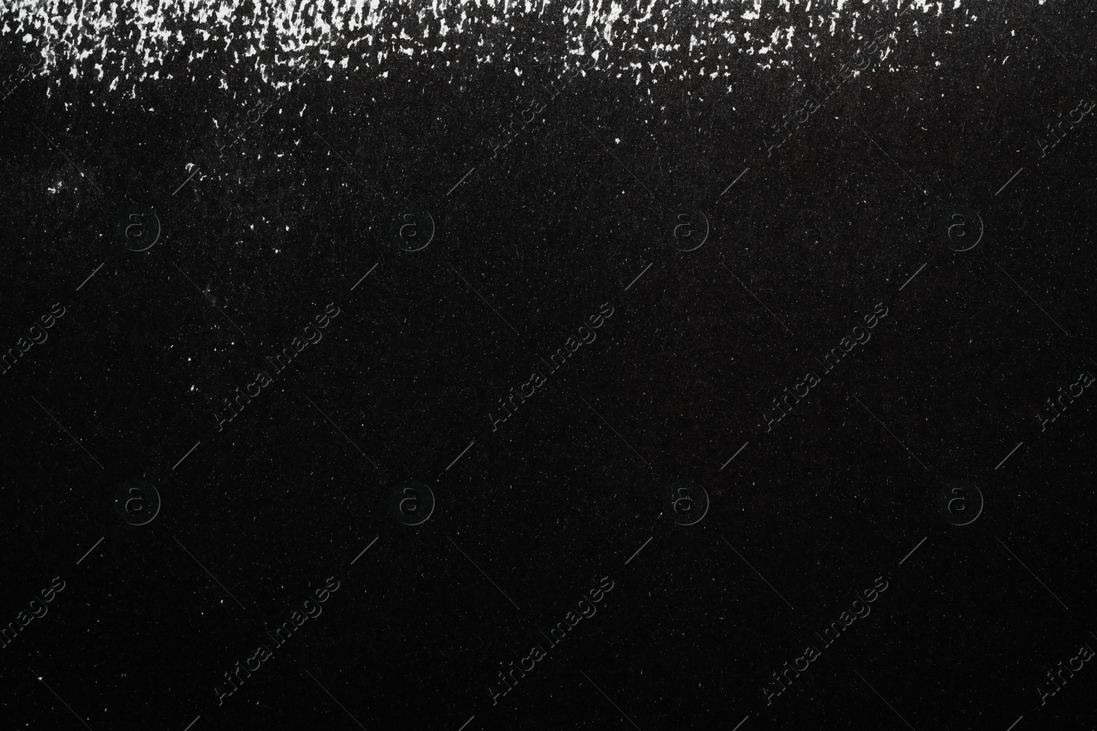 Photo of Texture of paper with black ink as background, top view