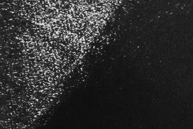 Photo of Texture of paper with black ink as background, top view