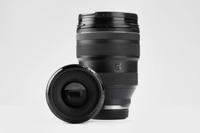 Camera lens on white background. Photographer's equipment