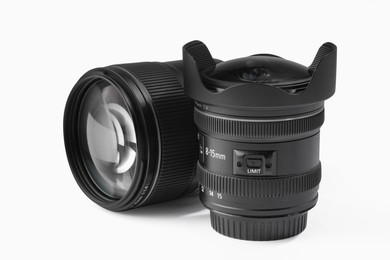 Camera lens on white background. Photographer's equipment