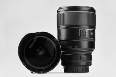 Camera lens on white background. Photographer's equipment