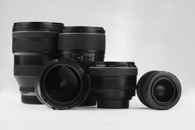 Camera lens on white background. Photographer's equipment