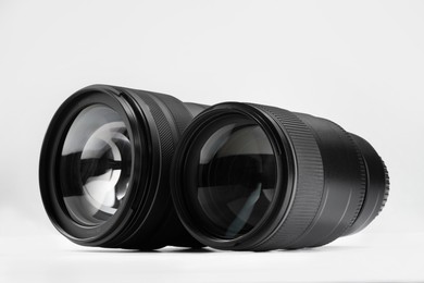 Photo of Camera lens on white background. Photographer's equipment