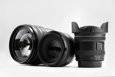 Camera lens on white background. Photographer's equipment