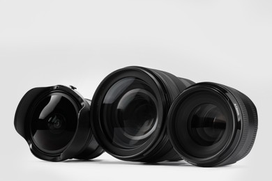 Camera lens on white background. Photographer's equipment