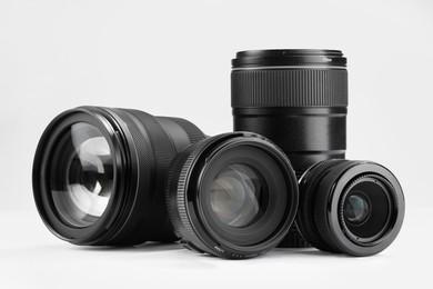 Camera lens on white background. Photographer's equipment