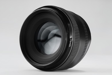 Photo of Camera lens on white background. Photographer's equipment