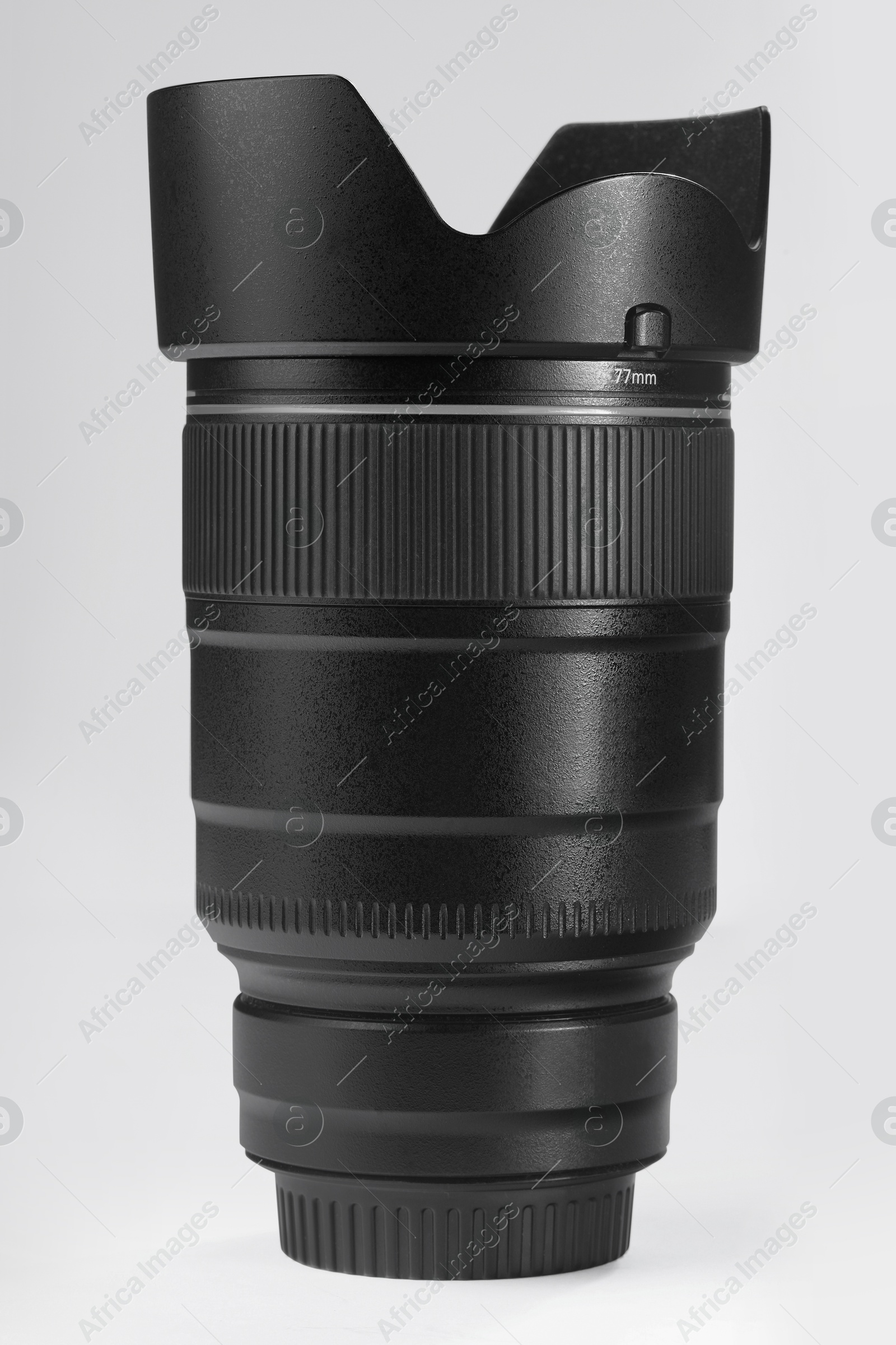 Photo of Camera lens isolated on white. Photographer's equipment