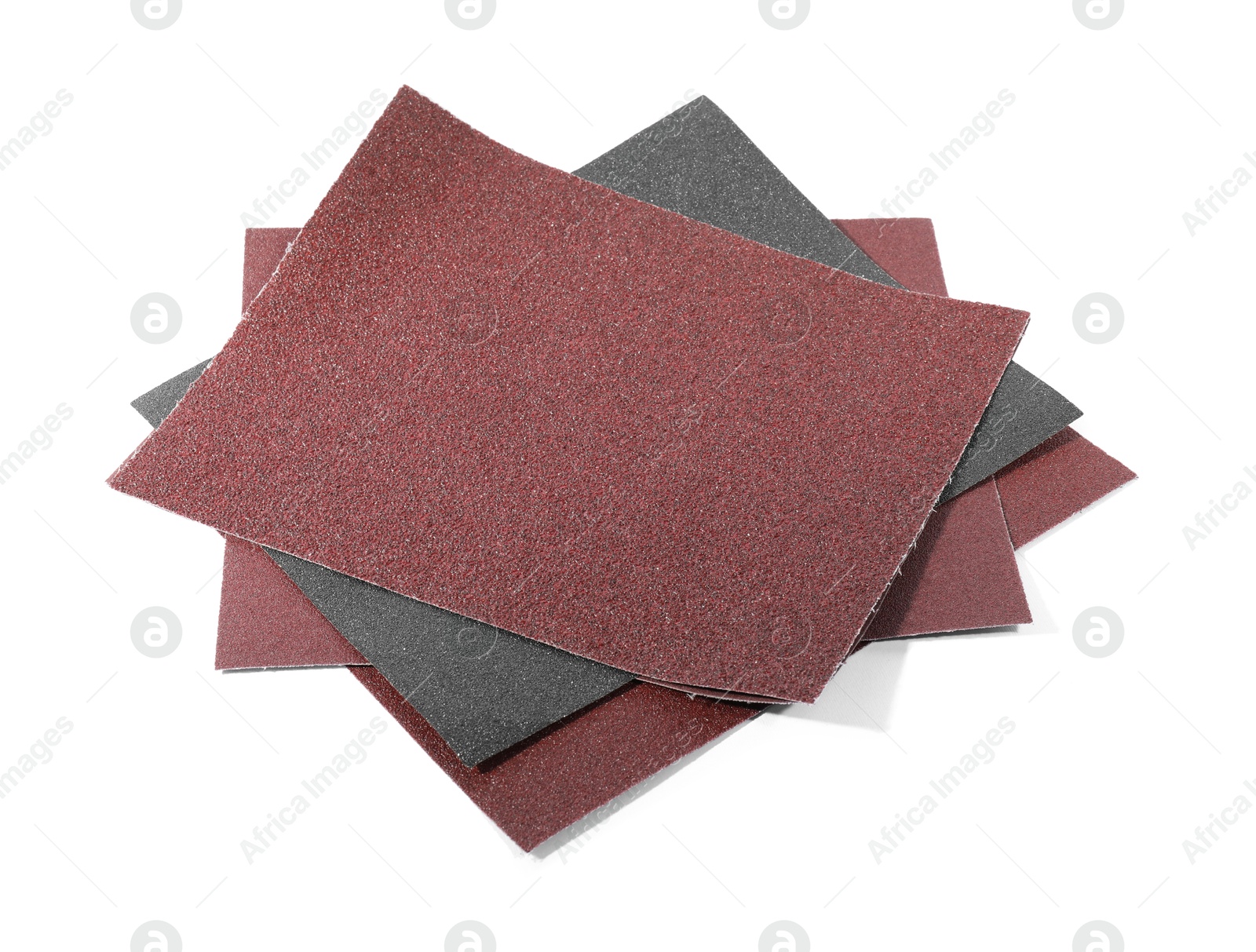 Photo of Many sheets of sandpaper isolated on white