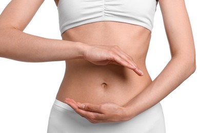 Photo of Healthy digestion. Woman holding something near her belly on white background, closeup