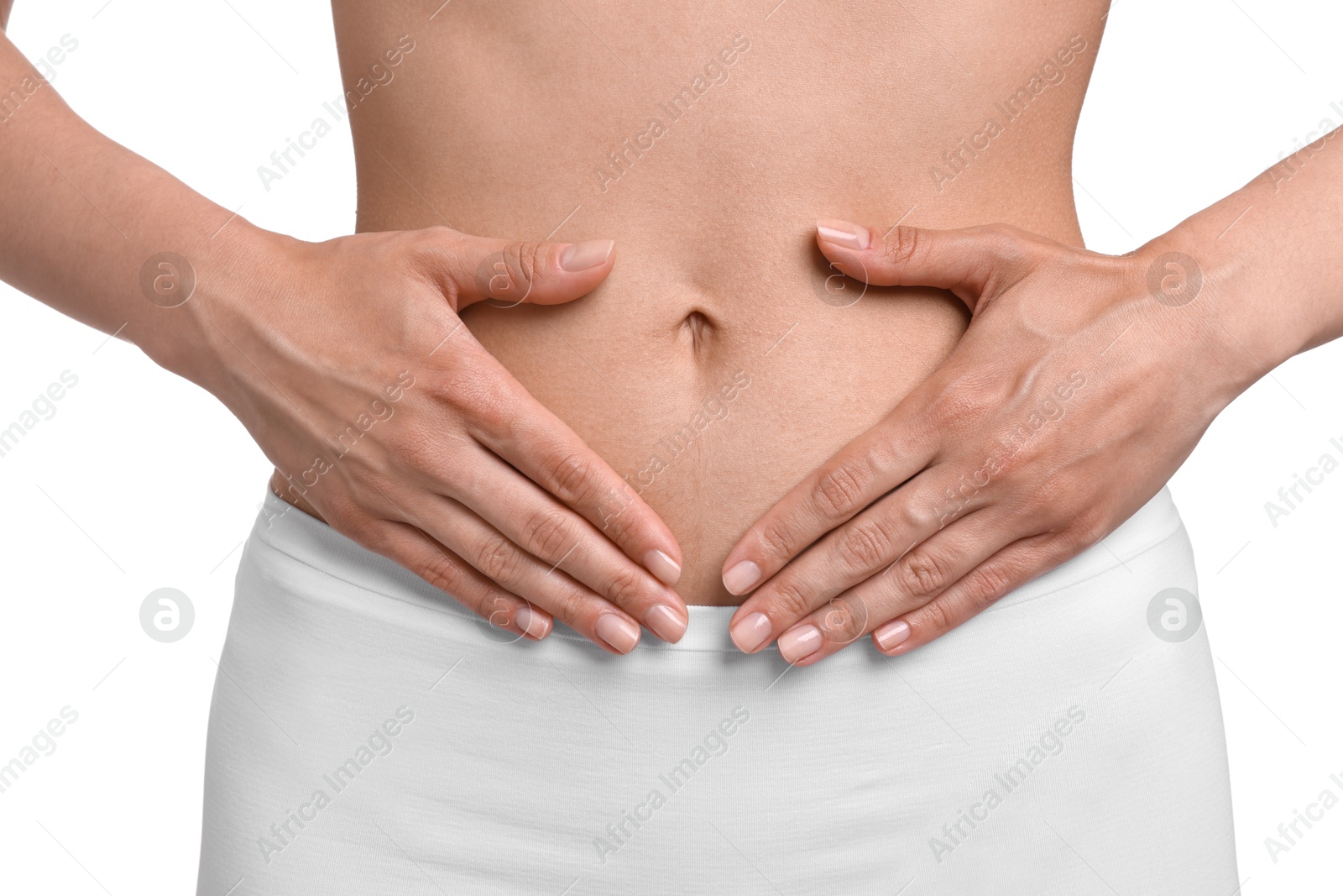 Photo of Healthy digestion. Woman making heart shape with hands near her belly on white background, closeup