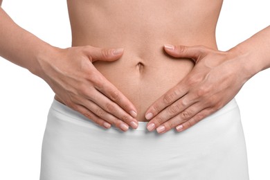 Photo of Healthy digestion. Woman making heart shape with hands near her belly on white background, closeup