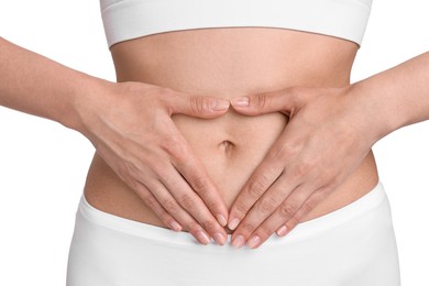 Healthy digestion. Woman making heart shape with hands near her belly on white background, closeup