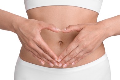 Photo of Healthy digestion. Woman making heart shape with hands near her belly on white background, closeup