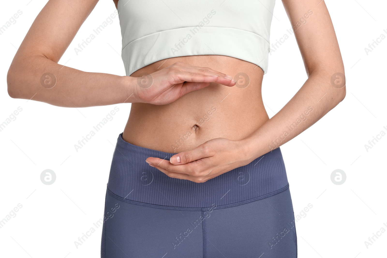 Photo of Healthy digestion. Woman holding something near her belly on white background, closeup