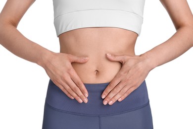 Photo of Healthy digestion. Woman making heart shape with hands near her belly on white background, closeup