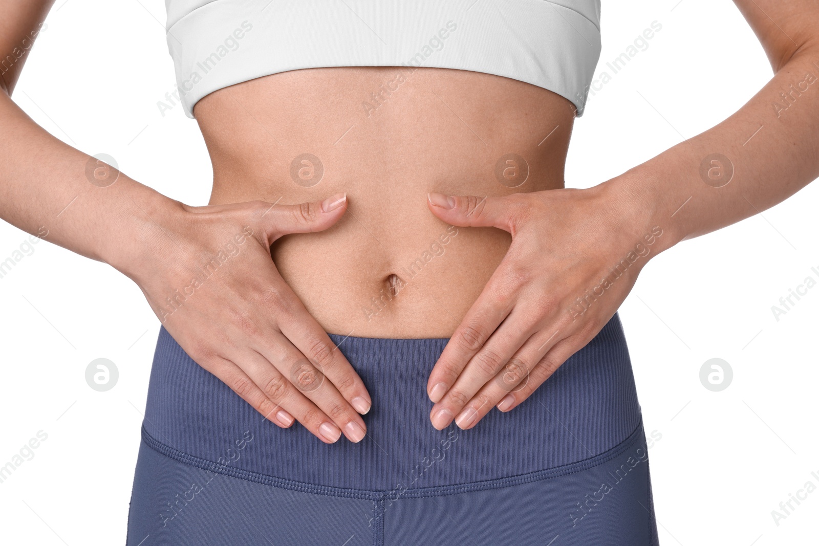 Photo of Healthy digestion. Woman making heart shape with hands near her belly on white background, closeup