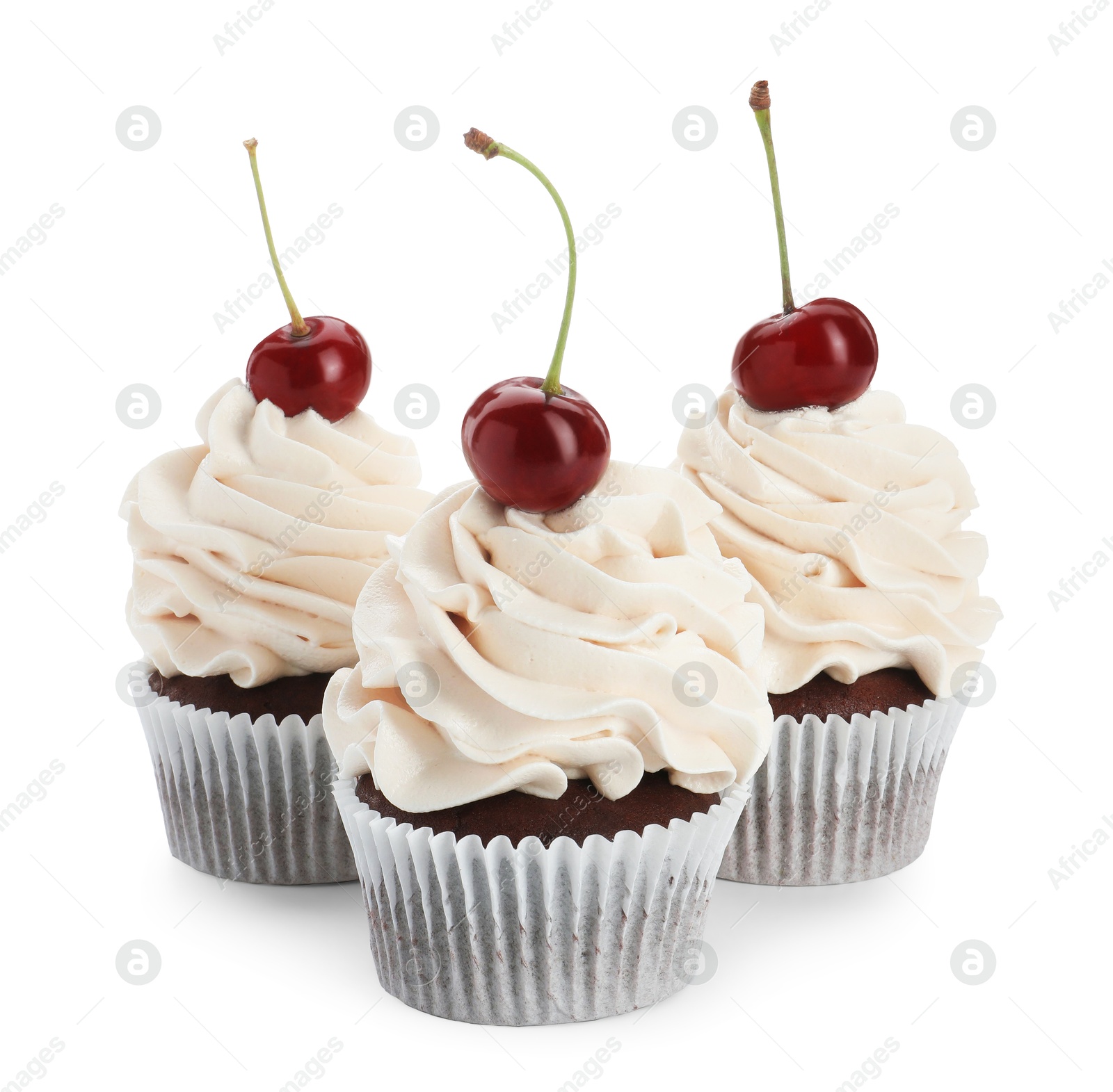 Photo of Delicious cupcakes with cream and cherries isolated on white