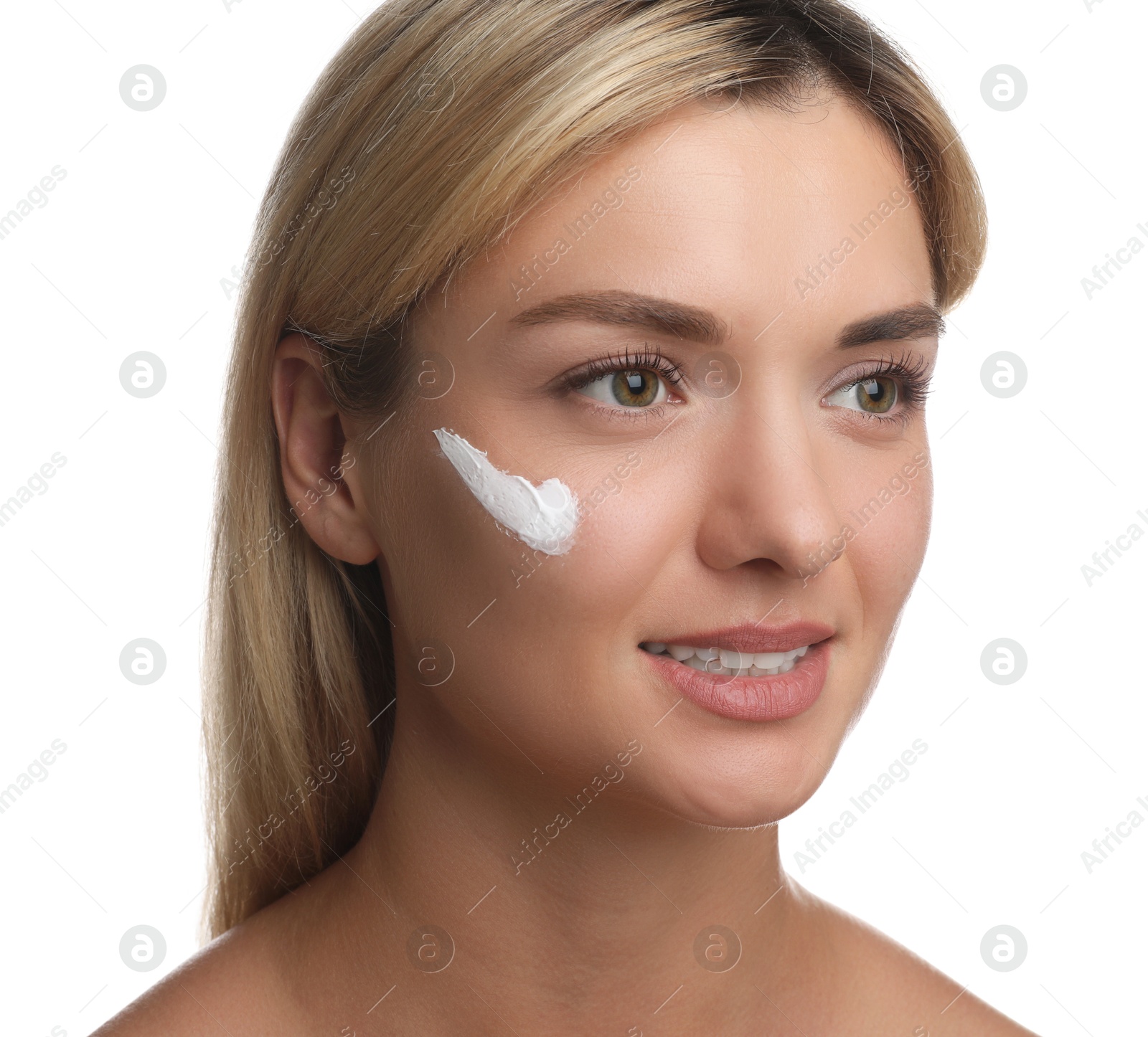 Photo of Beautiful woman with cream on her face against white background