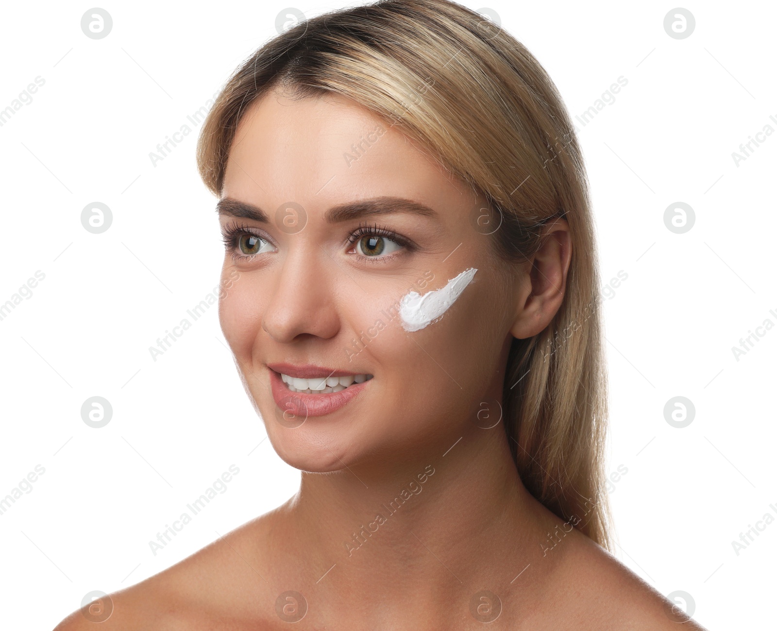 Photo of Beautiful woman with cream on her face against white background