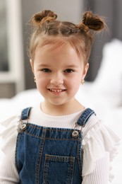 Portrait of happy little girl indoors. Cute child