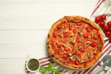 Photo of Tasty pizza with mushrooms, herbs and tomato on white wooden table, top view. Space for text