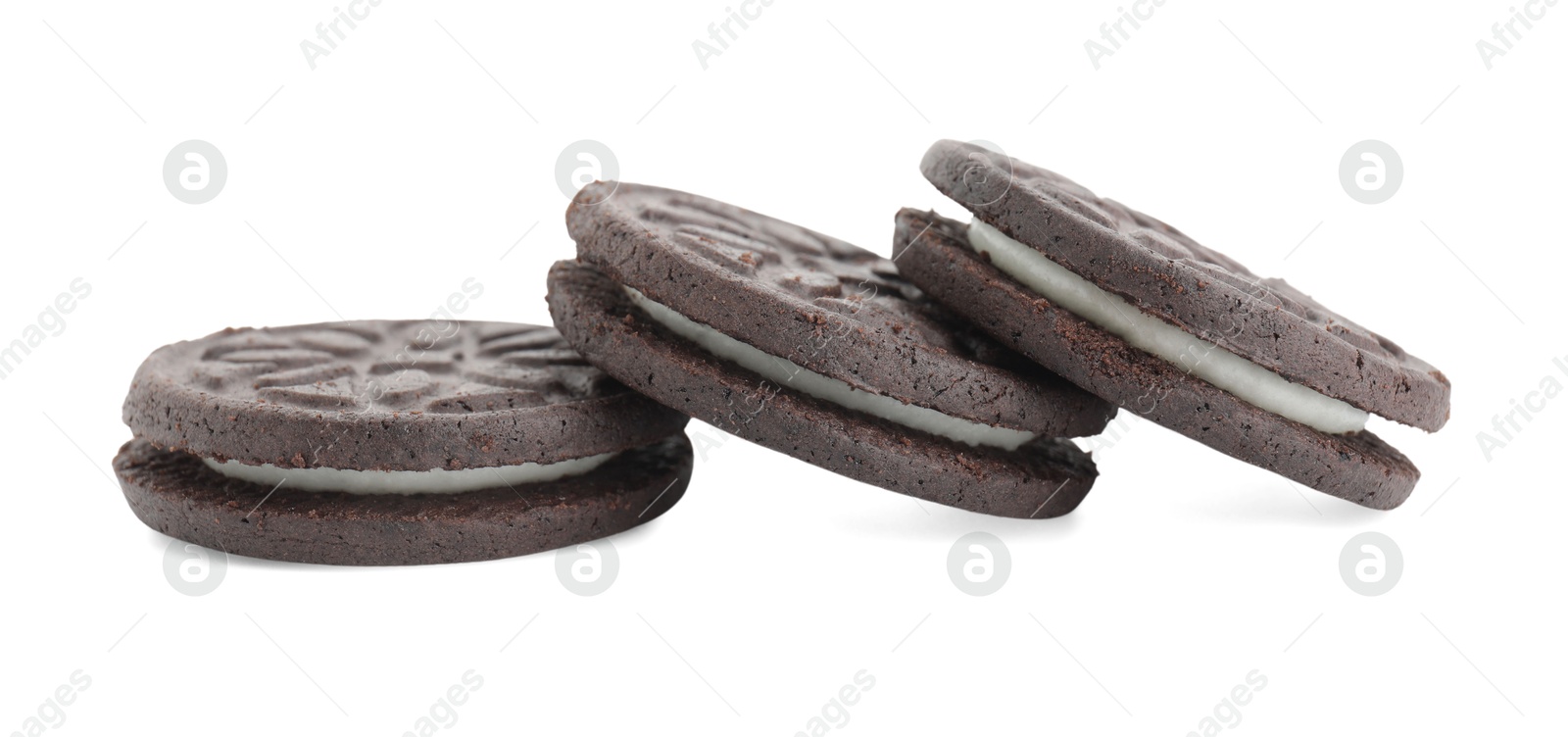 Photo of Three tasty sandwich cookies isolated on white