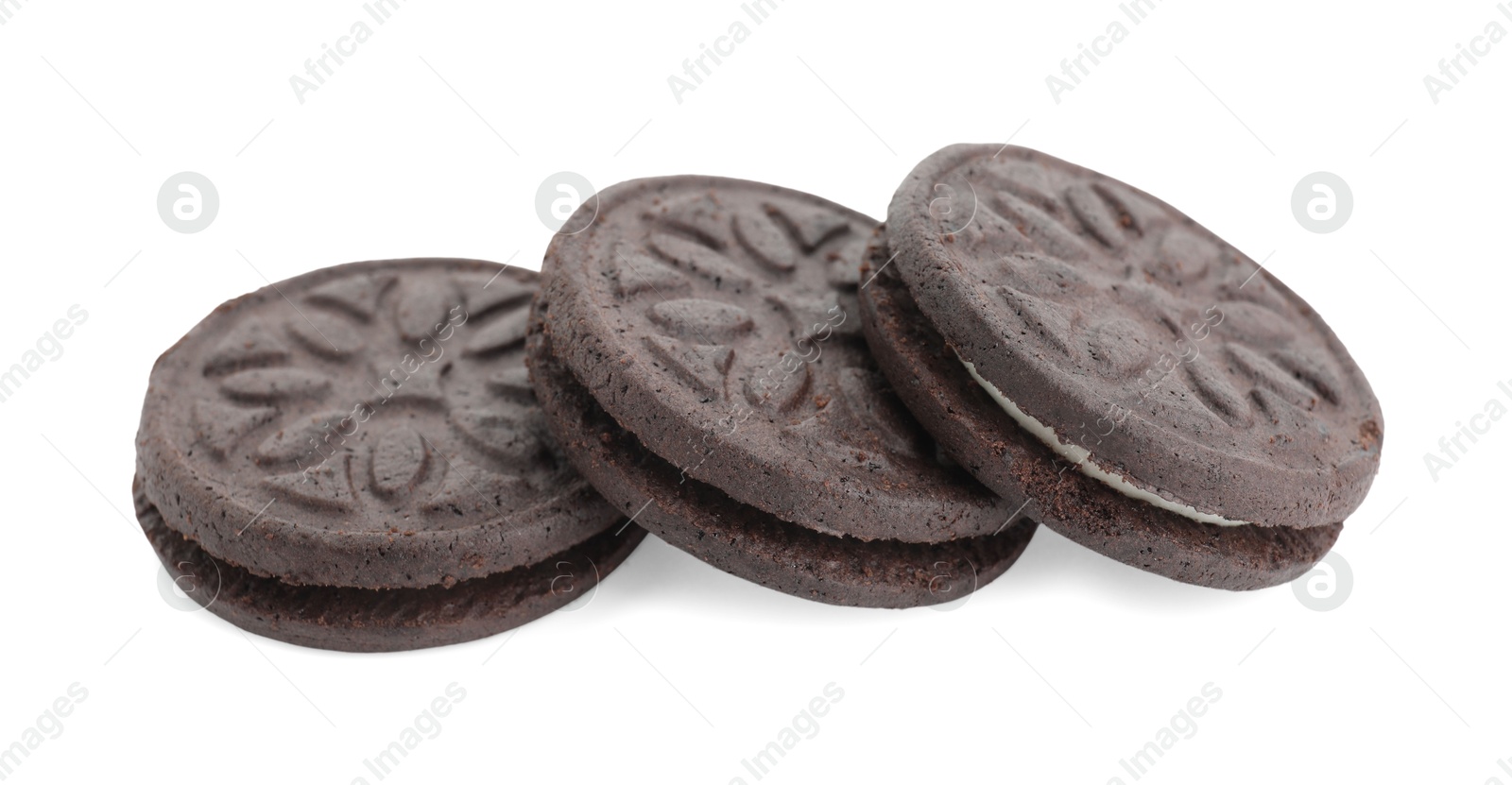 Photo of Three tasty sandwich cookies isolated on white