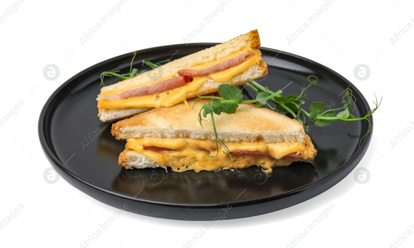 Photo of Pieces of toasted bread with melted cheese, ham and microgreens isolated on white