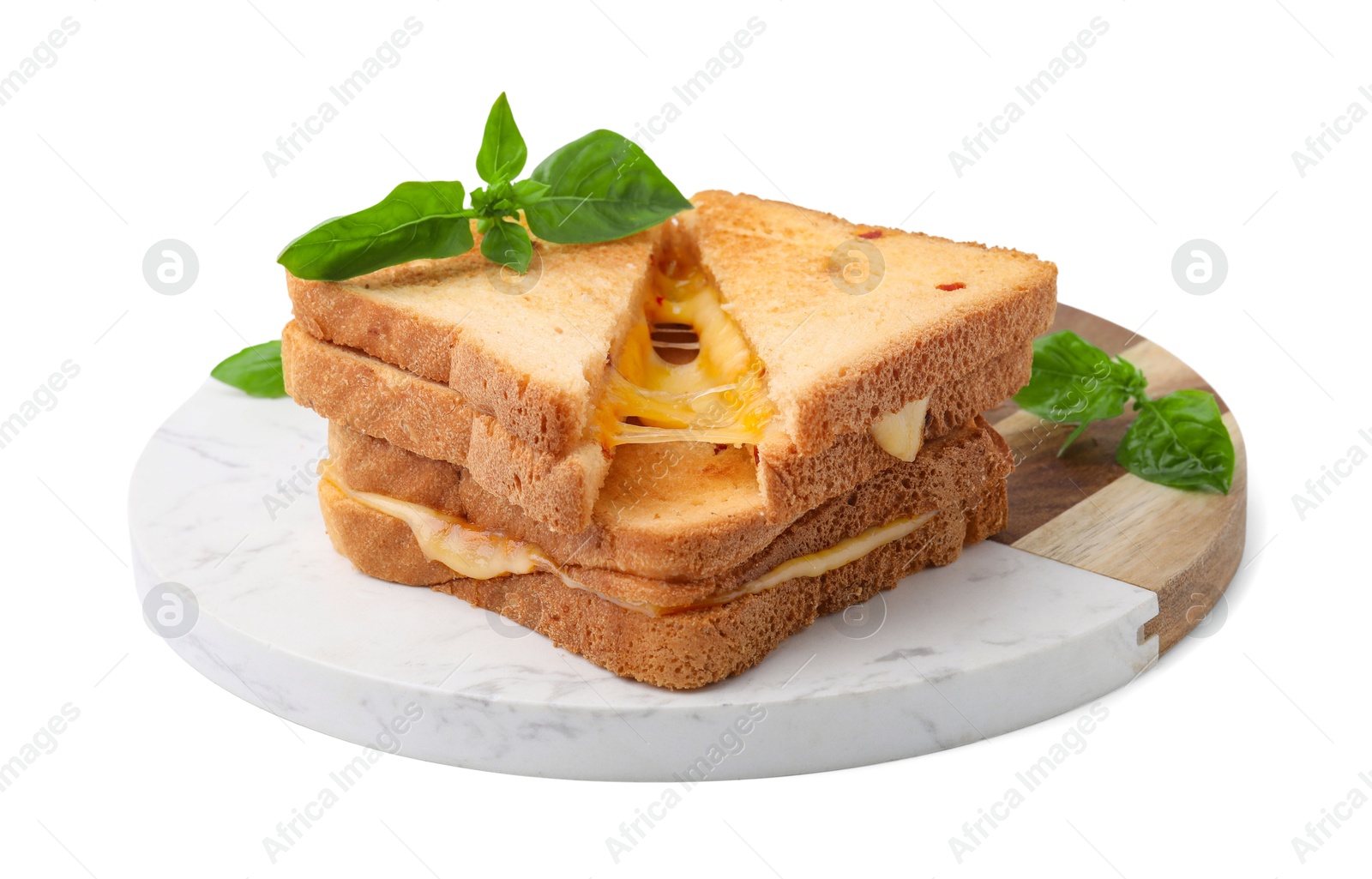 Photo of Pieces of toasted bread with melted cheese and basil isolated on white