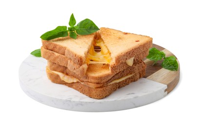 Photo of Pieces of toasted bread with melted cheese and basil isolated on white