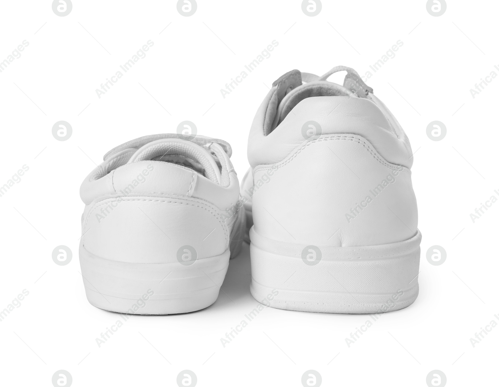 Photo of Big and small sneakers isolated on white