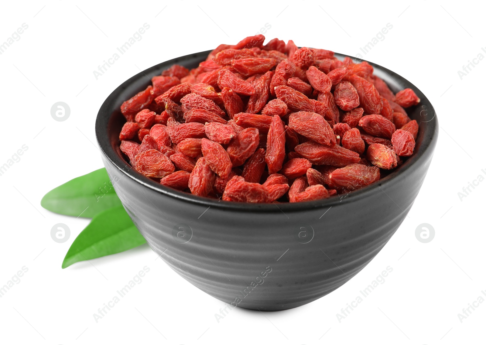 Photo of Dried goji berries in bowl isolated on white