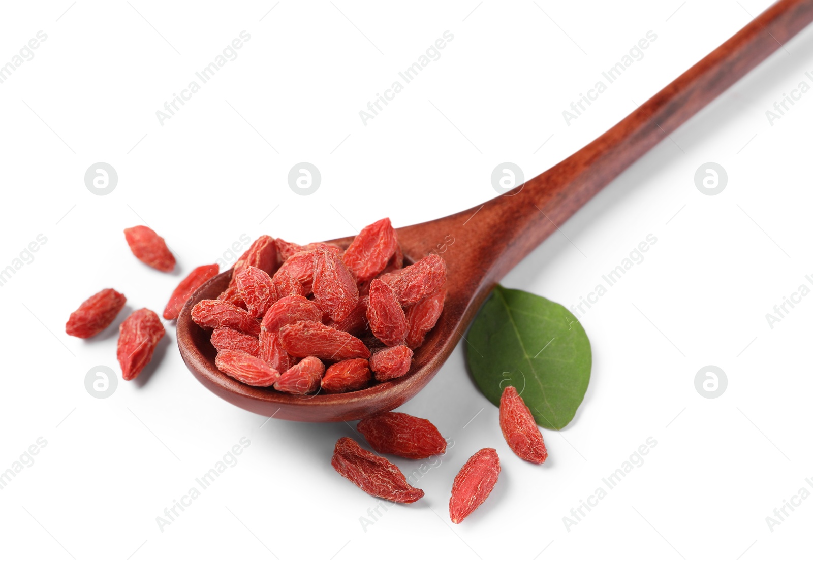 Photo of Spoon with dried goji berries and leaf isolated on white