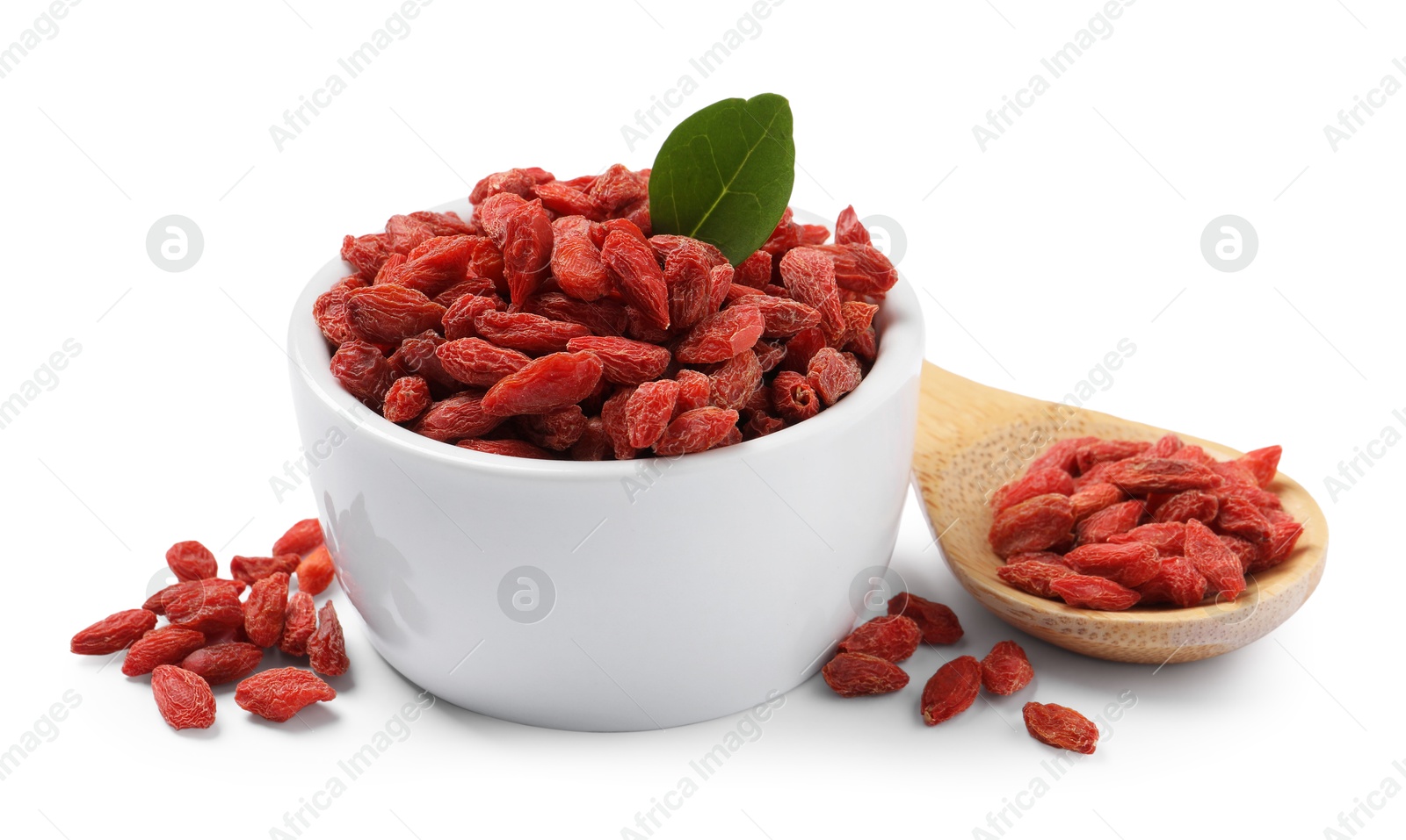 Photo of Dried goji berries in bowl and spoon isolated on white