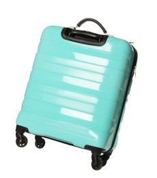 One new turquoise suitcase isolated on white