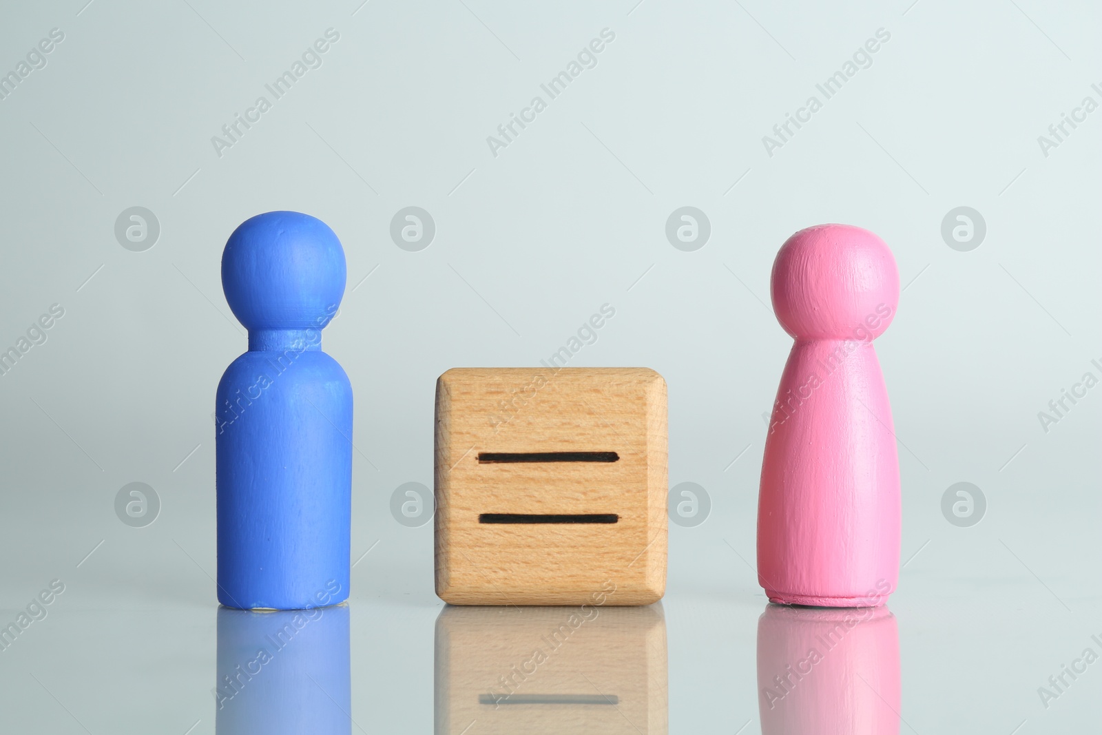 Photo of Gender equality concept. Male and female figures on light background