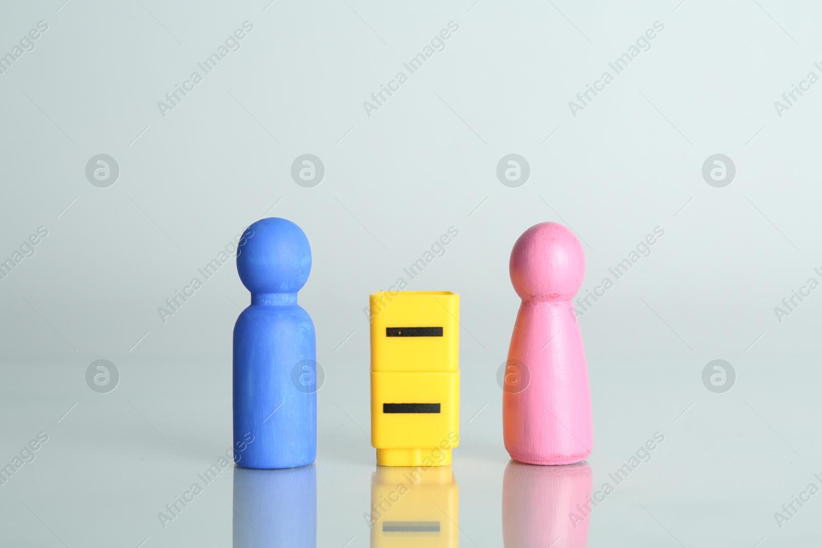 Photo of Gender equality concept. Male and female figures on light background