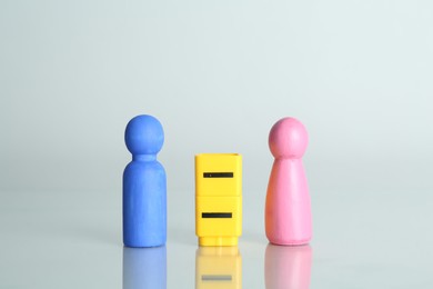 Photo of Gender equality concept. Male and female figures on light background