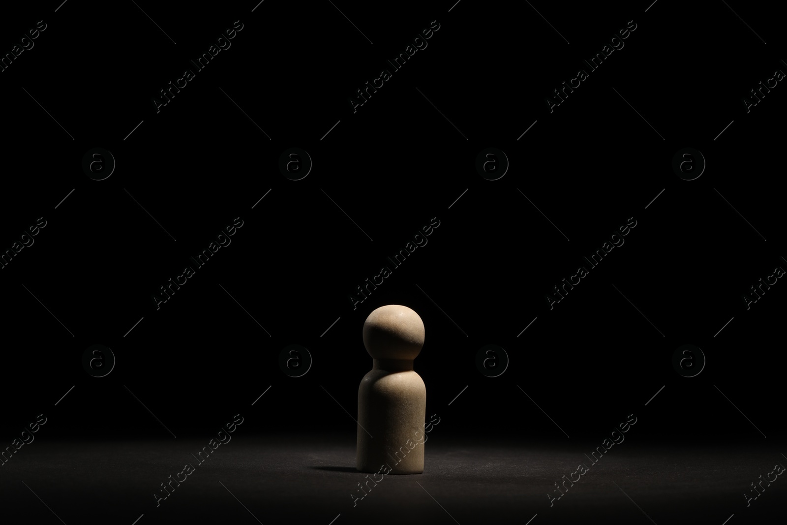 Photo of Loneliness concept. Human figure in darkness alone