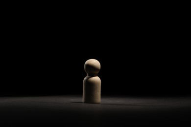 Photo of Loneliness concept. Human figure in darkness alone