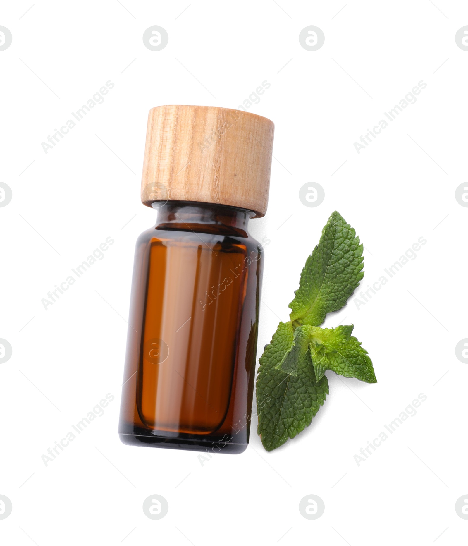 Photo of Bottle of essential oil and mint isolated on white, top view