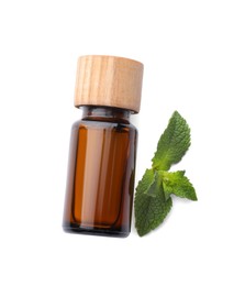 Bottle of essential oil and mint isolated on white, top view