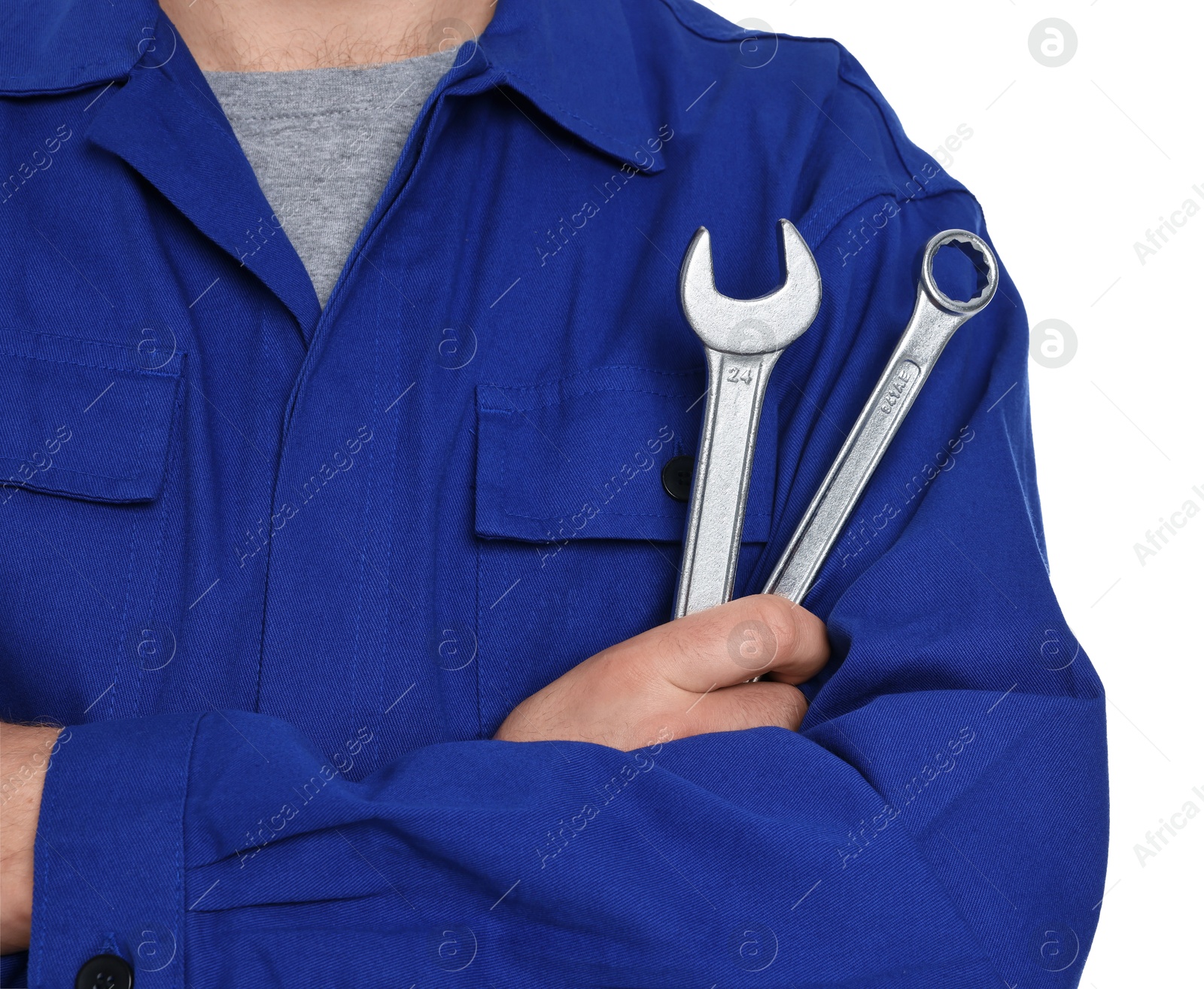 Photo of Professional auto mechanic with tools on white background, closeup