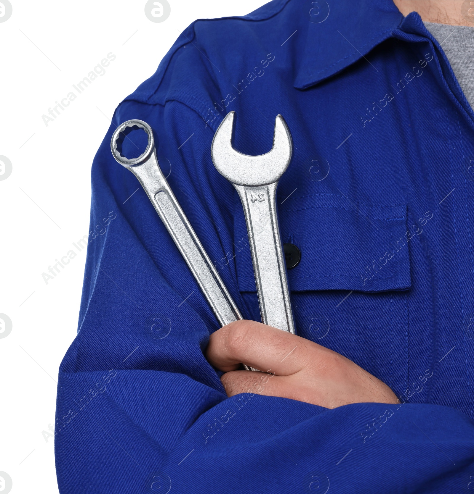 Photo of Professional auto mechanic with tools on white background, closeup