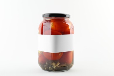 Photo of Tasty pickled tomatoes in jar on white background